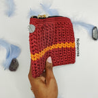 pochette rouge et orange sur la tranche
